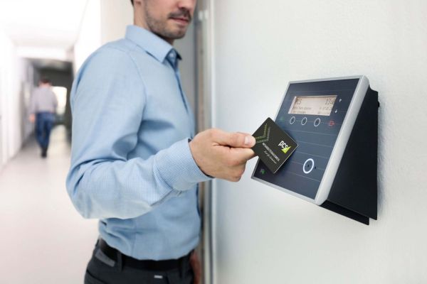 Employee using an access control system at a commercial property