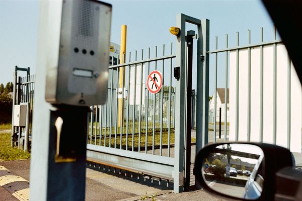 Industrial facility gate with access control system